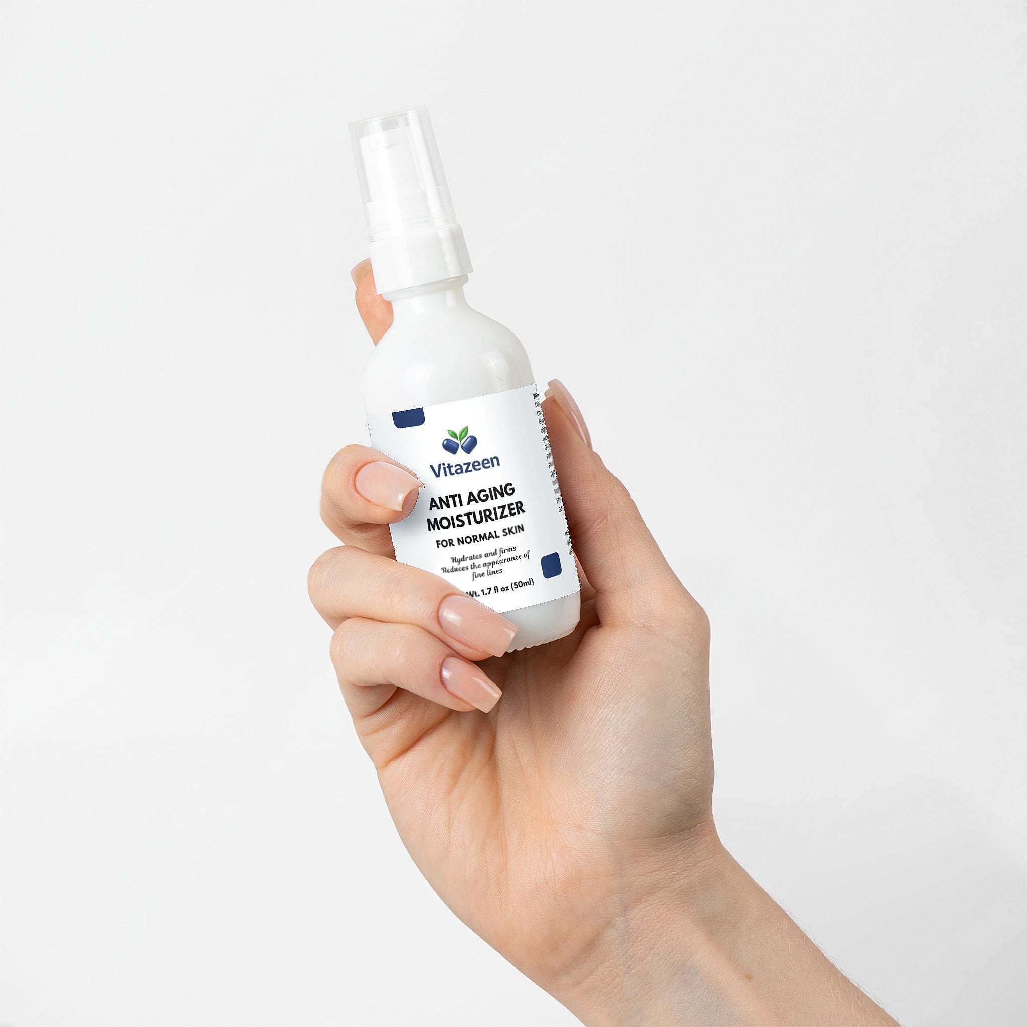 Hand holding a bottle of Vitanzen anti-aging moisturizer against a white background