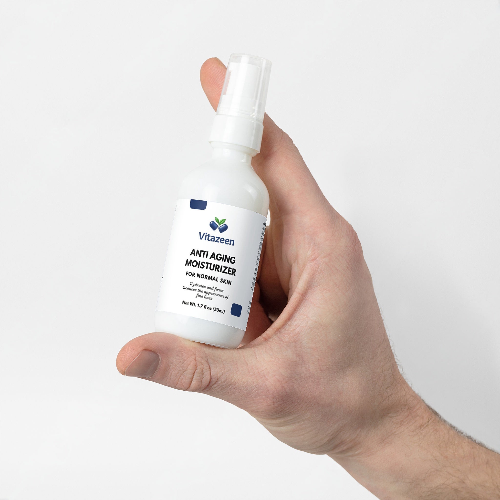 Hand holding a bottle of Vitaeen Anti Aging Moisturizer against a white background